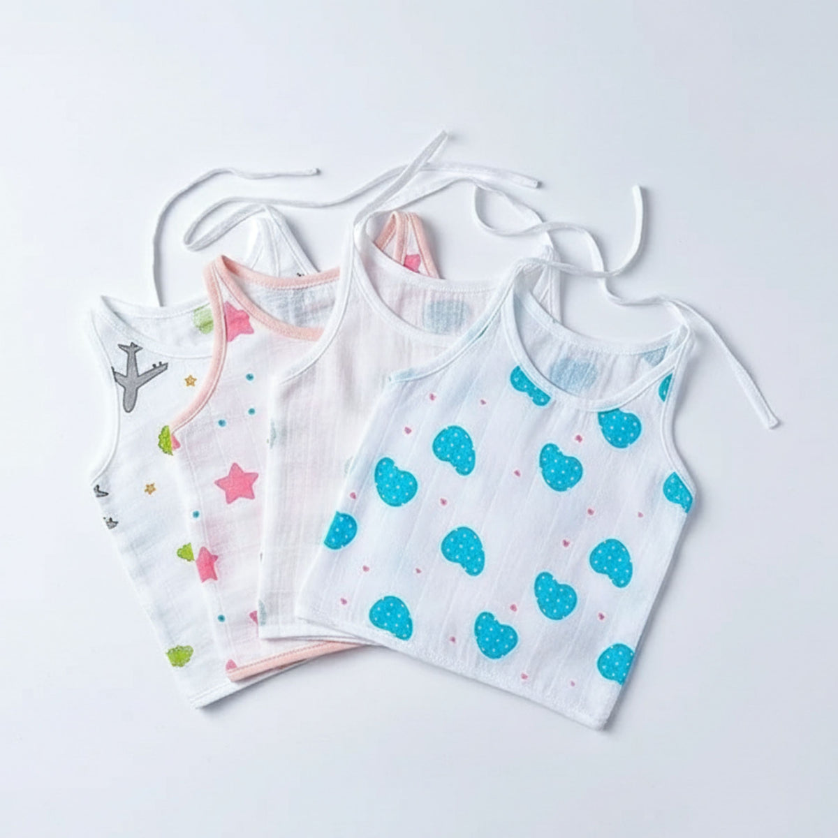 White printed sleeveless muslin jhablas with shoulder ties, pack of four option.