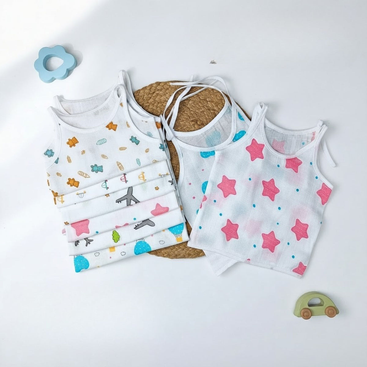 White printed sleeveless muslin jhablas with shoulder ties, pack of six option.